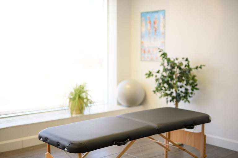 Modern physical therapy clinic room with treatment bed